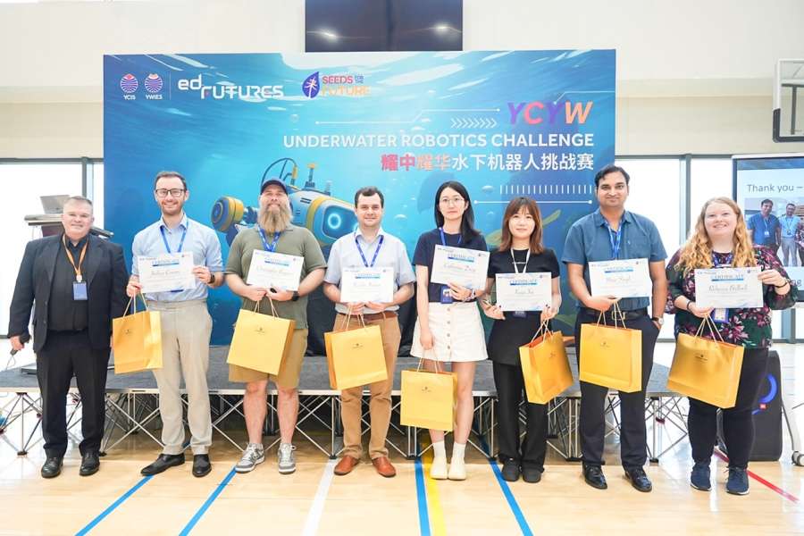 YCIS Beijing students and teachers celebrating underwater robotics competition success
