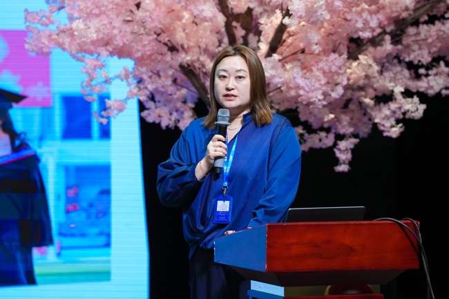 Academic counselor presenting at podium during IGCSE information session
