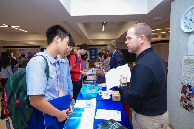 Students exploring IGCSE and IB subject information