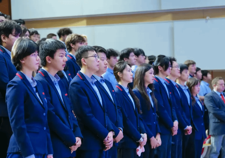 YCIS Beijing Year 12 IGCSE graduates standing together