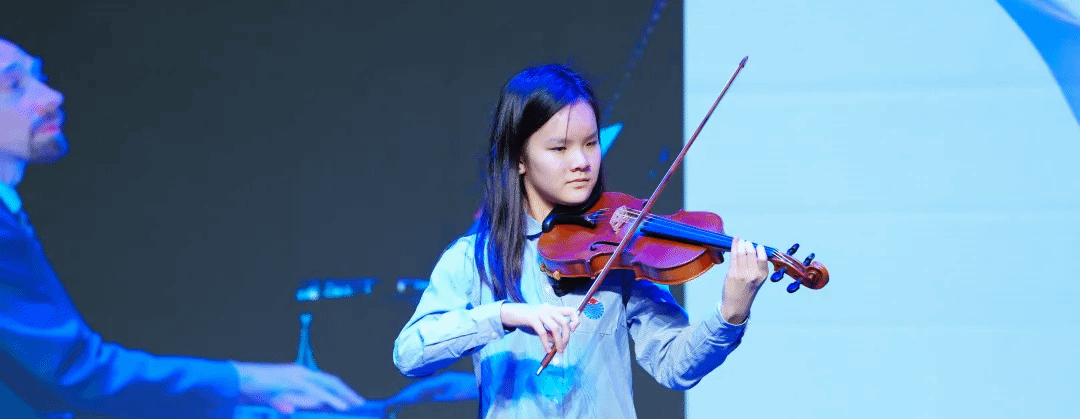 Student violin performance at YCIS Beijing IGCSE graduation ceremony