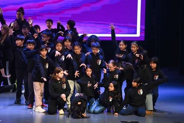 Audience and students enjoying the event