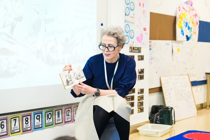 Ms. McCafferty reading a story to Year 1 students